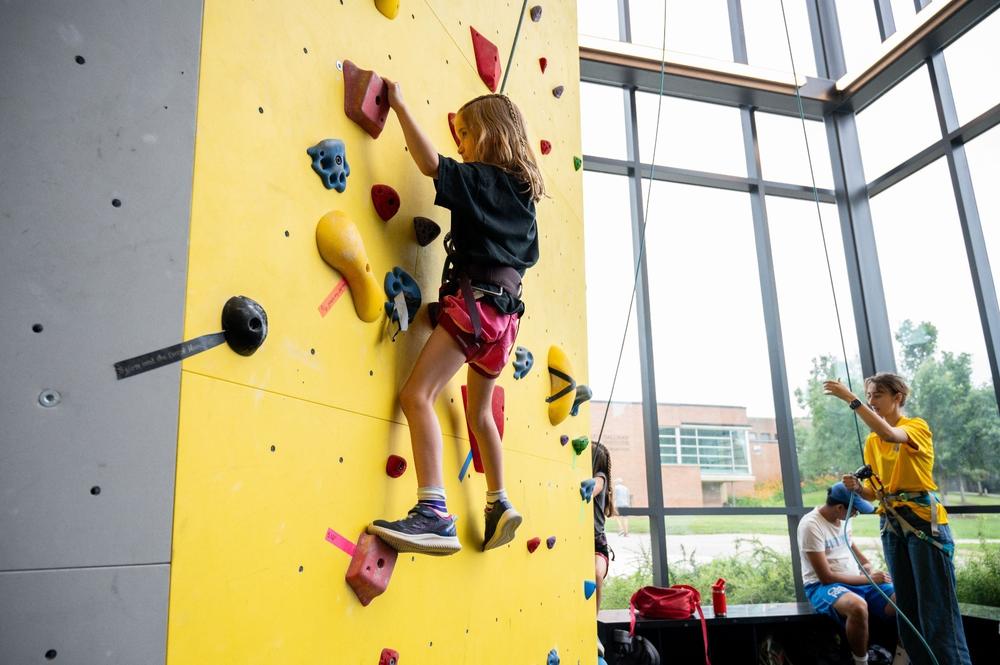 Photo of girl rock climbing during our youth sport camps 